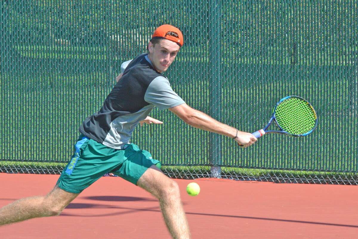 Alex Gray, who will be a junior at Edwardsville, prepares to make a backhand return on Wednesday during his second-round consolation match in the Pro Wild Card Challenge at the EHS Tennis Center.
