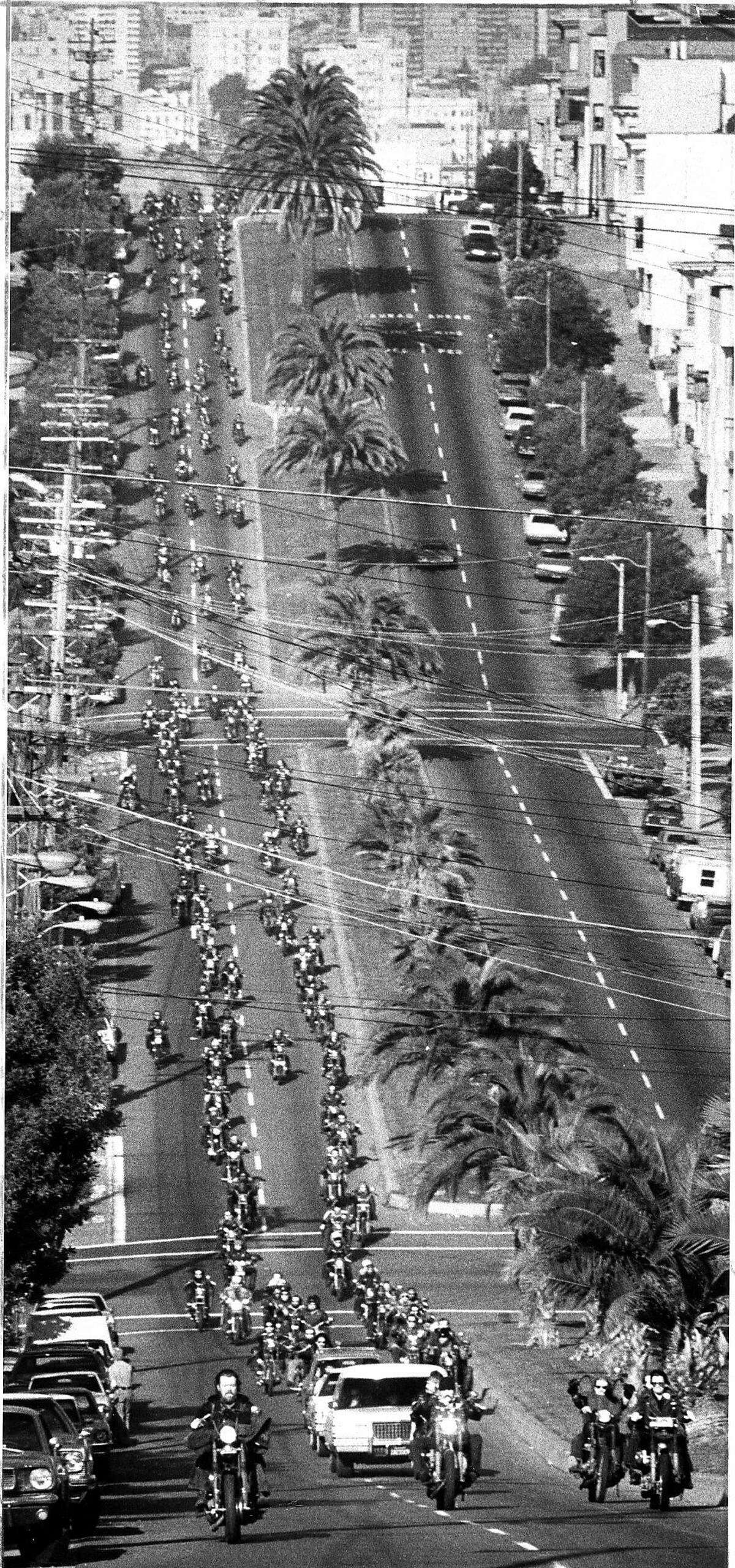 Hells Angels and members of other motorcycle clubs form a funeral cortege aloong Dolores Street for Harry the Horse Flamburis, January 14, 1977 Photo ran 01/15/1977 P. 2