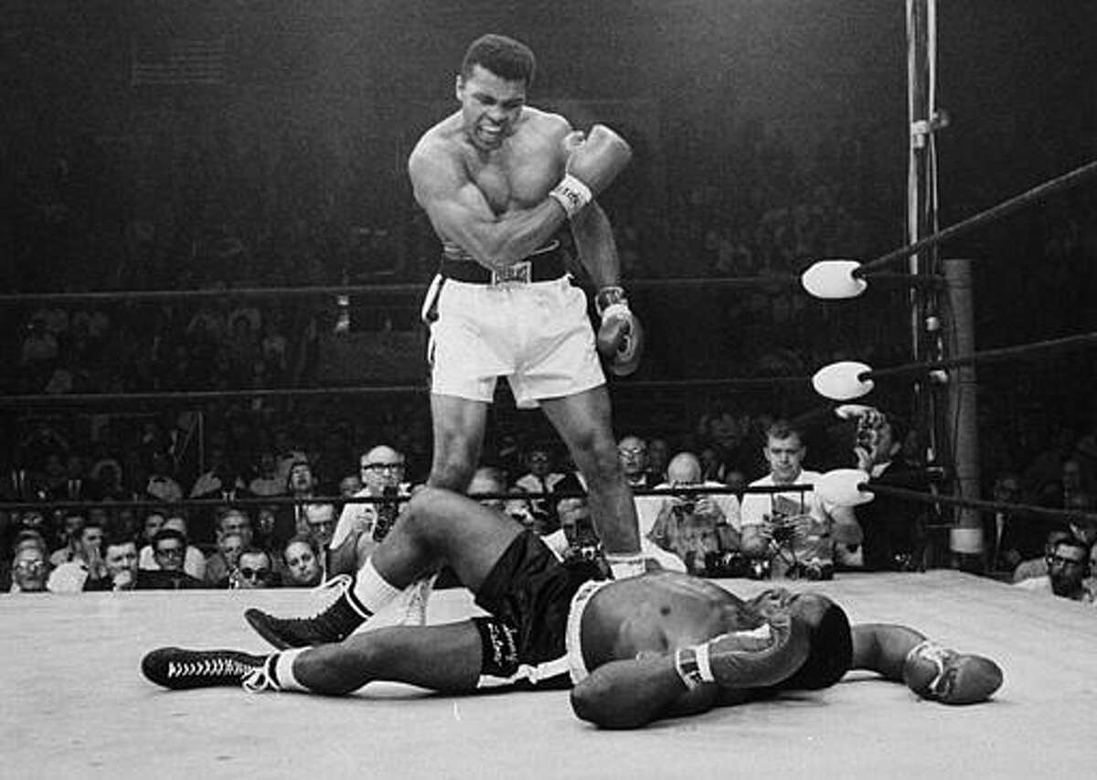 Heavyweight champion Muhammad Ali stands over fallen challenger Sonny Liston, shouting and gesturing shortly after dropping Liston with a short hard right to the jaw on May 25, 1965, in Lewiston, Maine. The bout lasted only one minute into the first round. Ali is the only man ever to win the world heavyweight boxing championship three times. He also won a gold medal in the light-heavyweight division at the 1960 Summer Olympic Games in Rome as a member of the U.S. Olympic boxing team. In 1964 he dropped the name Cassius Clay and adopted the Muslim name Muhammad Ali.