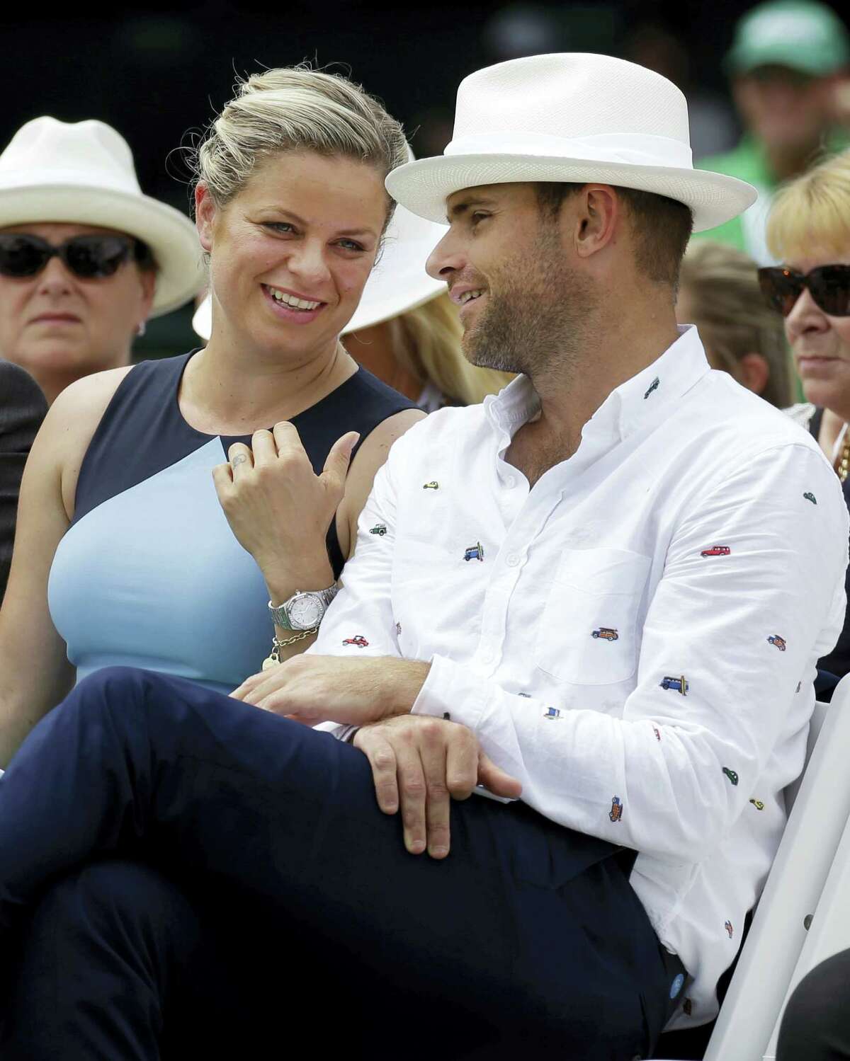 Tennis Hall of Fame inductees Kim Clijsters, left, and Andy Roddick chat during enshrinement ceremonies Saturday in Newport, R.I.