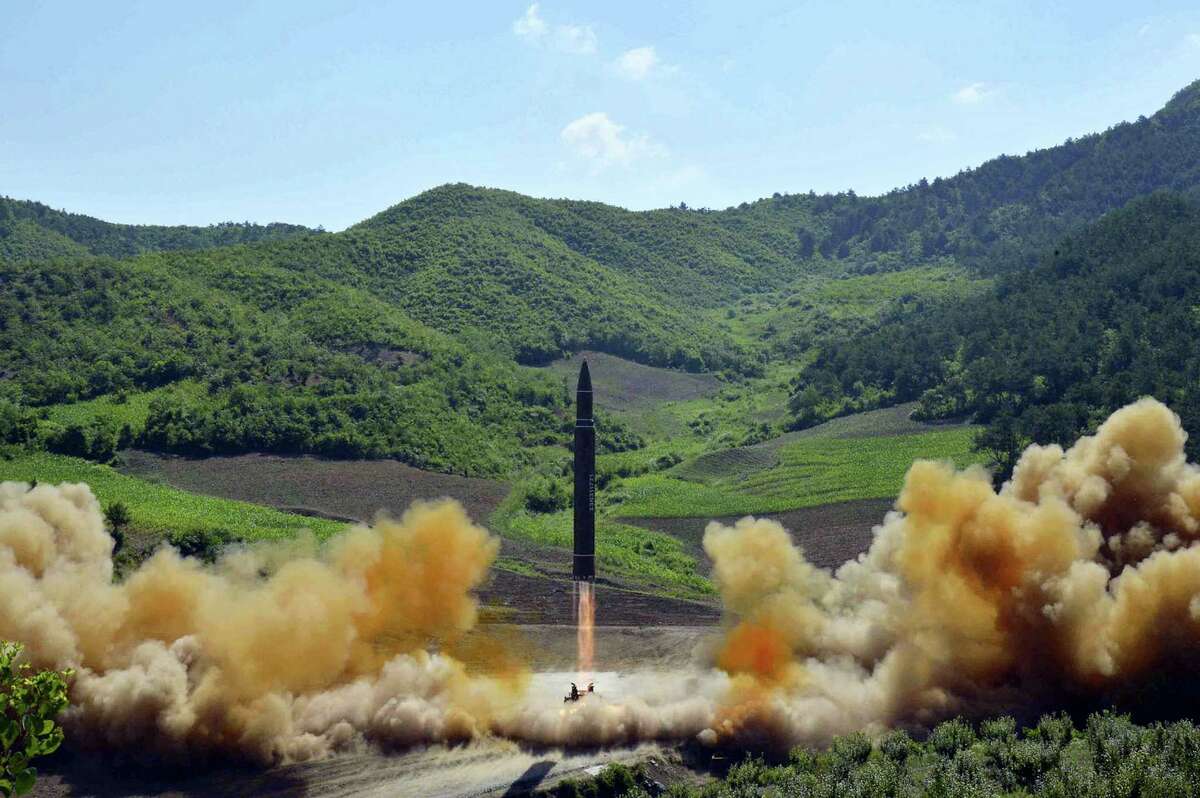 In this July 4, 2017 file photo, distributed by the North Korean government shows what was said to be the launch of a Hwasong-14 intercontinental ballistic missile in North Korea. North Korea fired a ballistic missile Friday night, July 28, which landed in the ocean off Japan, Japanese officials said.