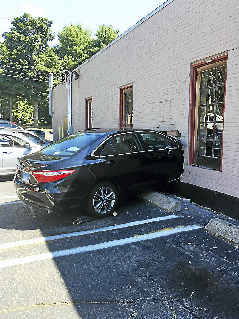 Car crashes into Milford hair salon