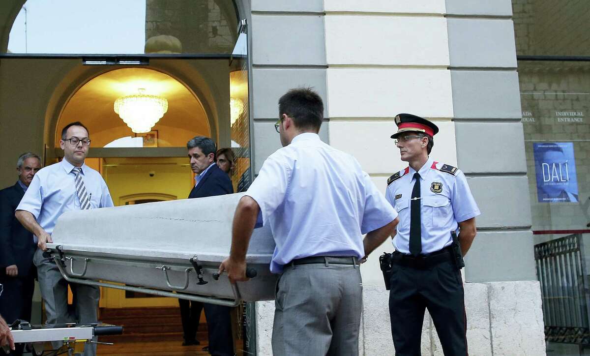 Workers bring a casket to the Dali Theater Museum in Figueres, Spain, Thursday, July 20, 2017. Salvador Dali’s eccentric artistic and personal history took yet another bizarre turn Thursday with the exhumation of his embalmed remains in order to find genetic samples that could settle whether one of the founding figures of surrealism fathered a daughter decades ago.