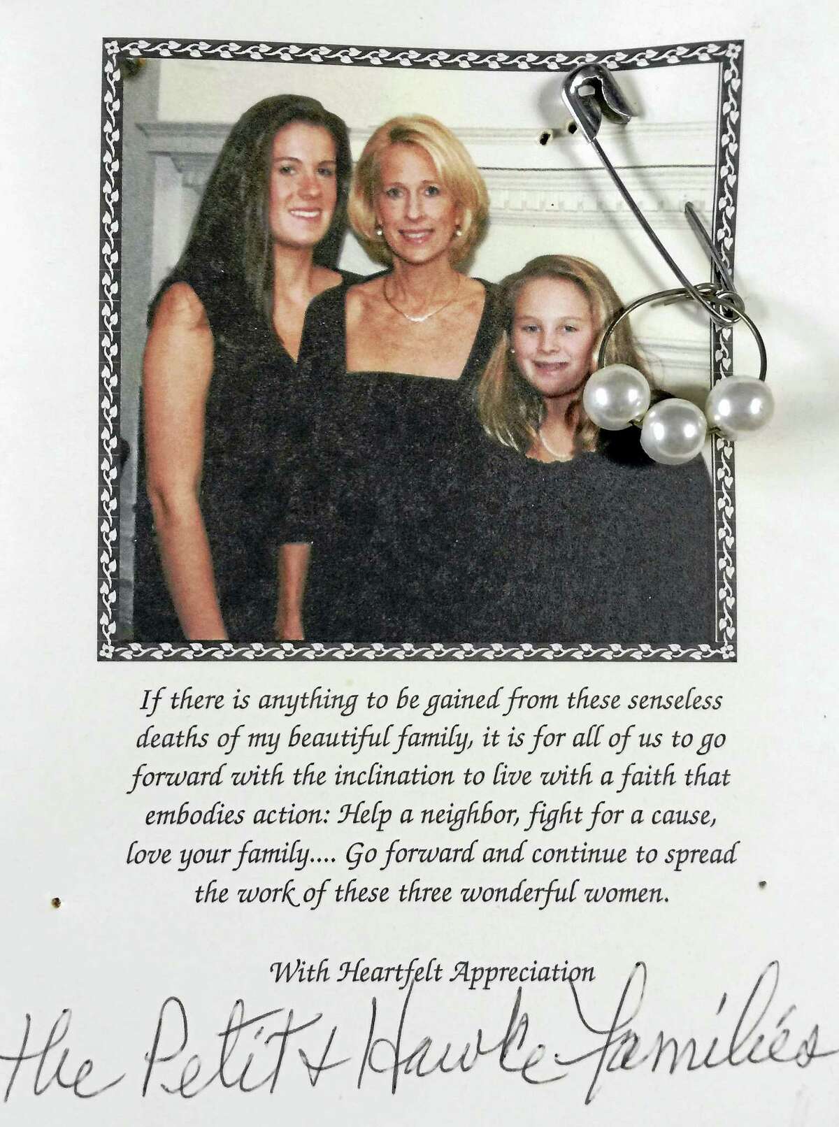Harriet Linder has a bulletin board in her home that serves as a reminder of the Petit family. Part of the space on it is reserved for a thank you card for a donation her family made to The Petit Family Foundation. Attached to it is A safety pin with a loop of metal through the bottom. Attached to it is a metal loop with three faux pearls, one for each of the Petit woman. Epstein distributed the pins to neighbors in a show of solidarity with the familyContributed photo
