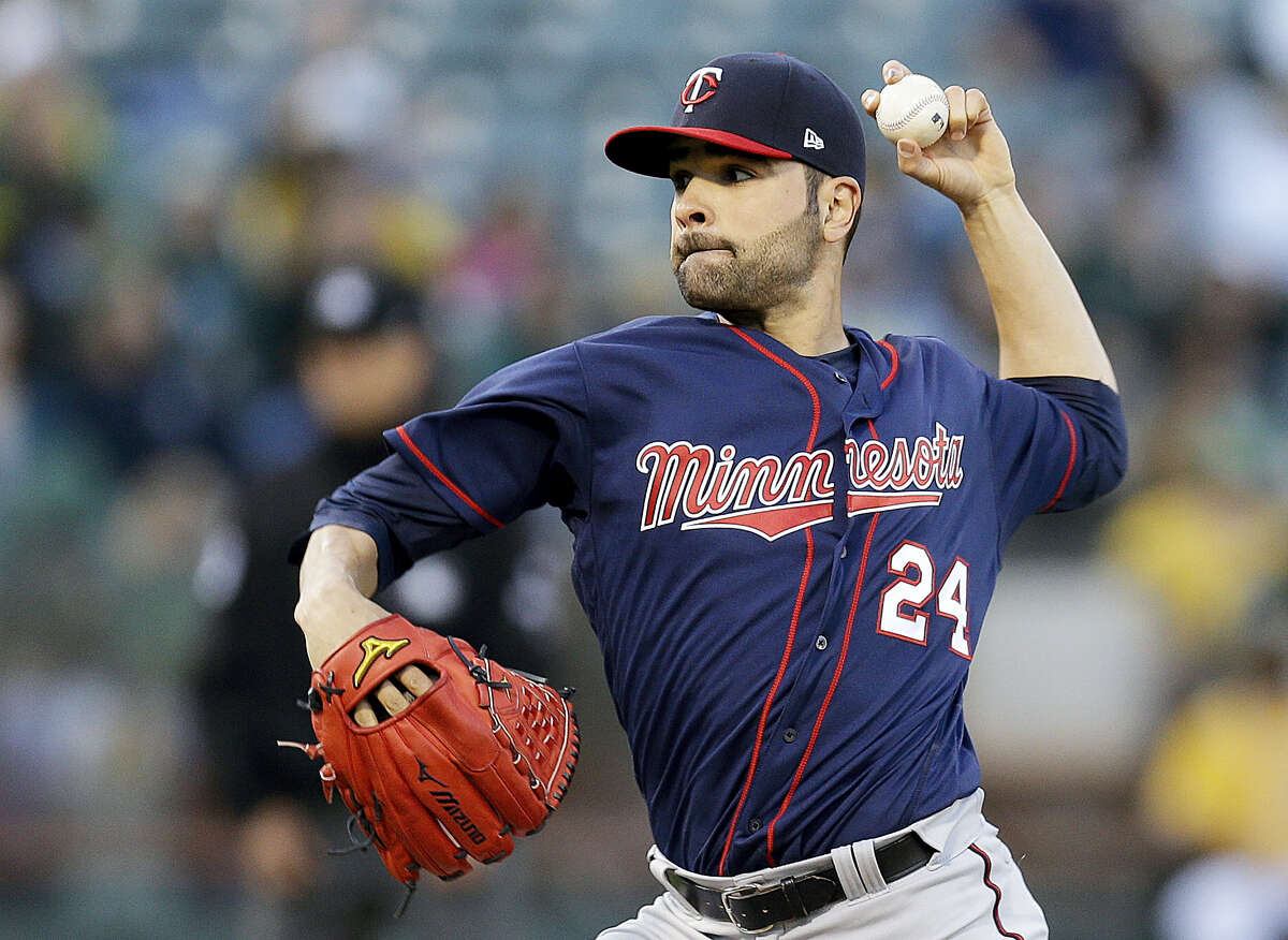 This photo taken July 28, 2017 shows Minnesota Twins pitcher Jaime Garci­a working against the Oakland Athletics during the first inning of a baseball game in Oakland, Calif. The Yankees bolstered their rotation a day before the non-waiver trade deadline as they acquired Garcia from the Minnesota Twins for a pair of minor league pitchers.
