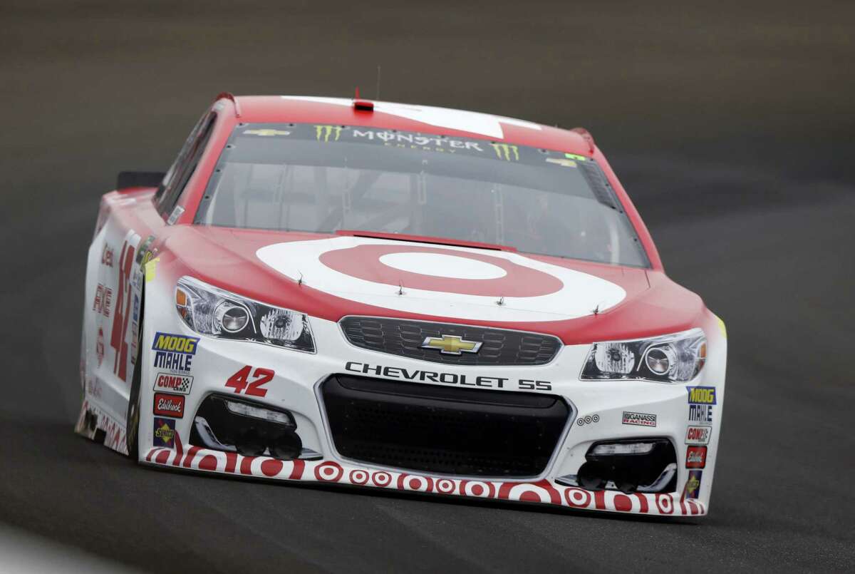 Kyle Larson drives through the first turn at Indianapolis Motor Speedway.