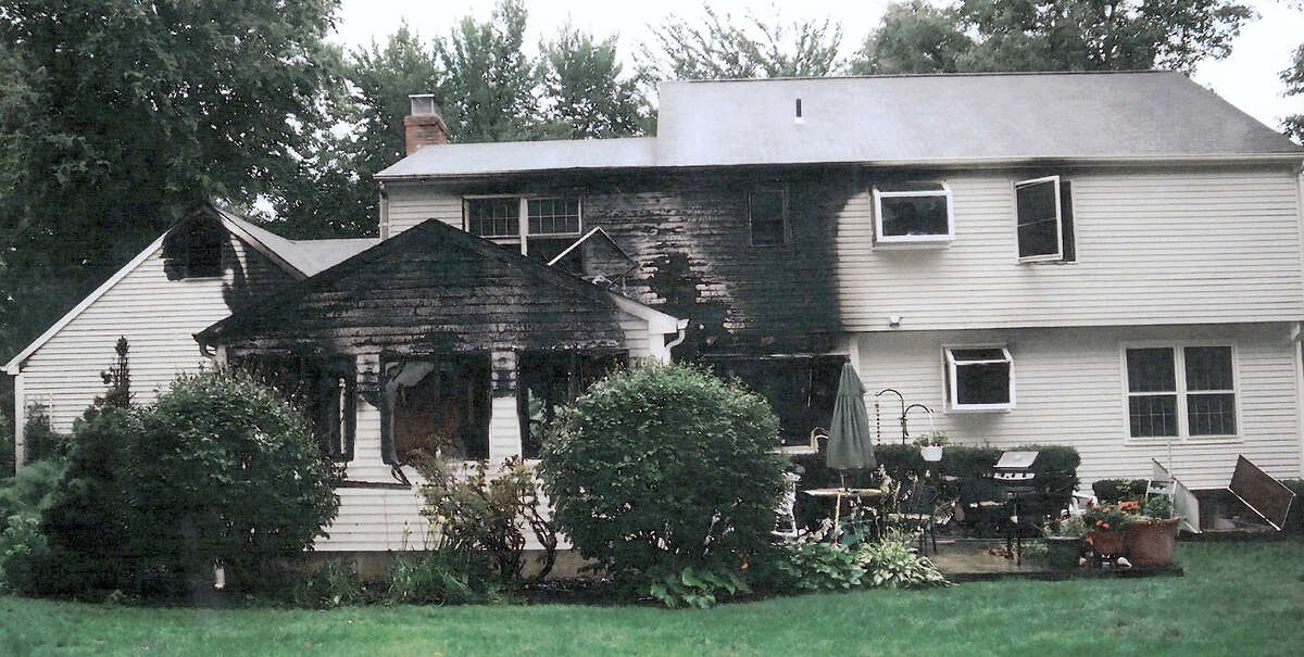 This July 2007 photo provided by police, made available Sept. 21, 2011 by the Connecticut Judicial Branch as evidence and presented in the Joshua Komisarjevsky trial in New Haven, Conn., shows a fire-damaged portion of the William Petit home in Cheshire, Conn., where his wife Jennifer Hawke-Petit and daughters Hayley and Michaela were killed during a home invasion July 23, 2007.