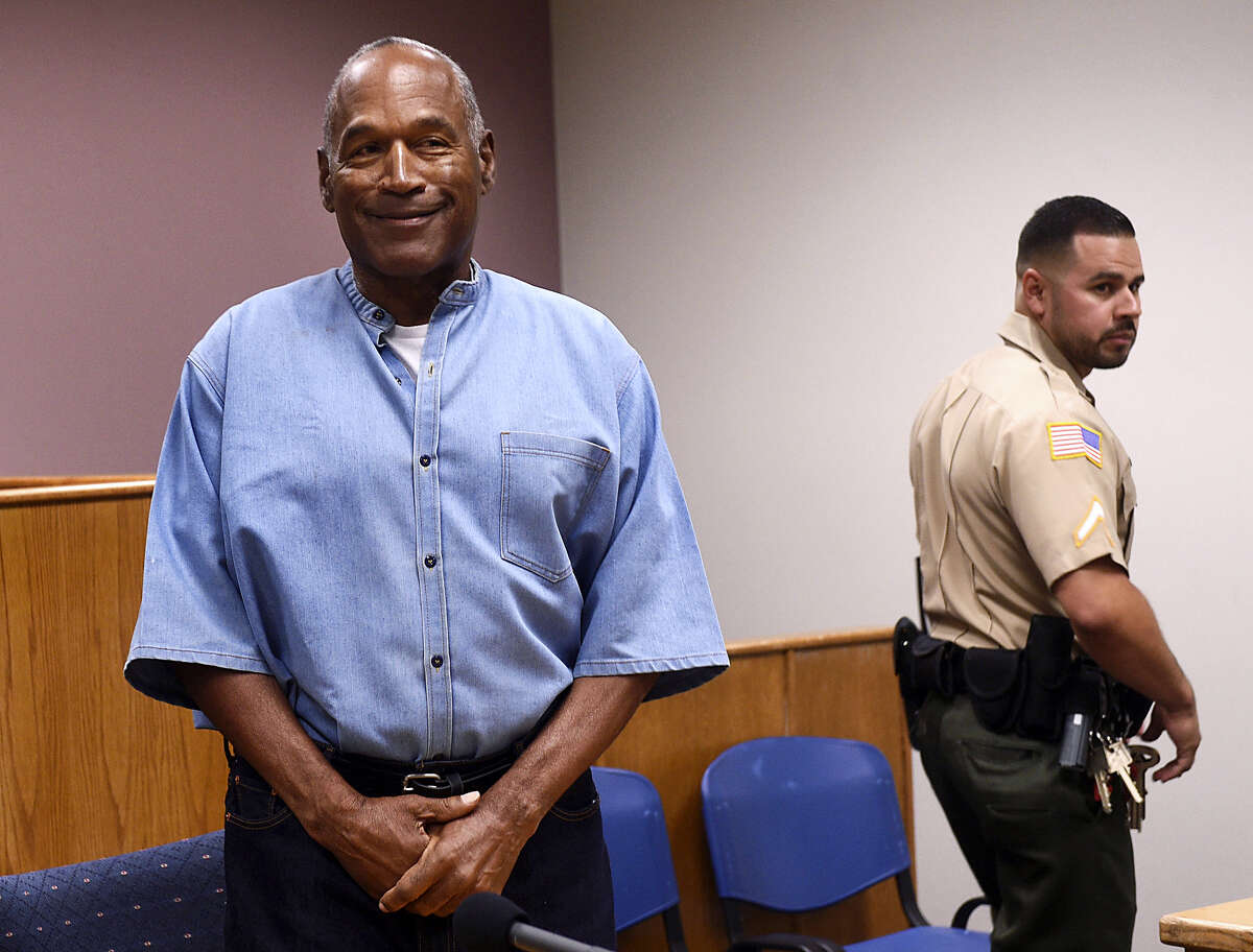 Former NFL football star O.J. Simpson enters for his parole hearing at the Lovelock Correctional Center in Lovelock, Nev., on Thursday. Simpson was convicted in 2008 of enlisting some men he barely knew, including two who had guns, to retrieve from two sports collectibles sellers some items that Simpson said were stolen from him a decade earlier.