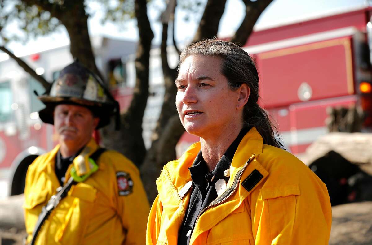 Oakland Battalion Chief Melinda Drayton holds a press conference,as firefighters get the upper hand on a fast moving fire along Grizzly Peak Blvd. on Wed. August 2, 2017, in Berkeley, Ca. Moraga Orinda Fire Chief Stephen Healy is at left.