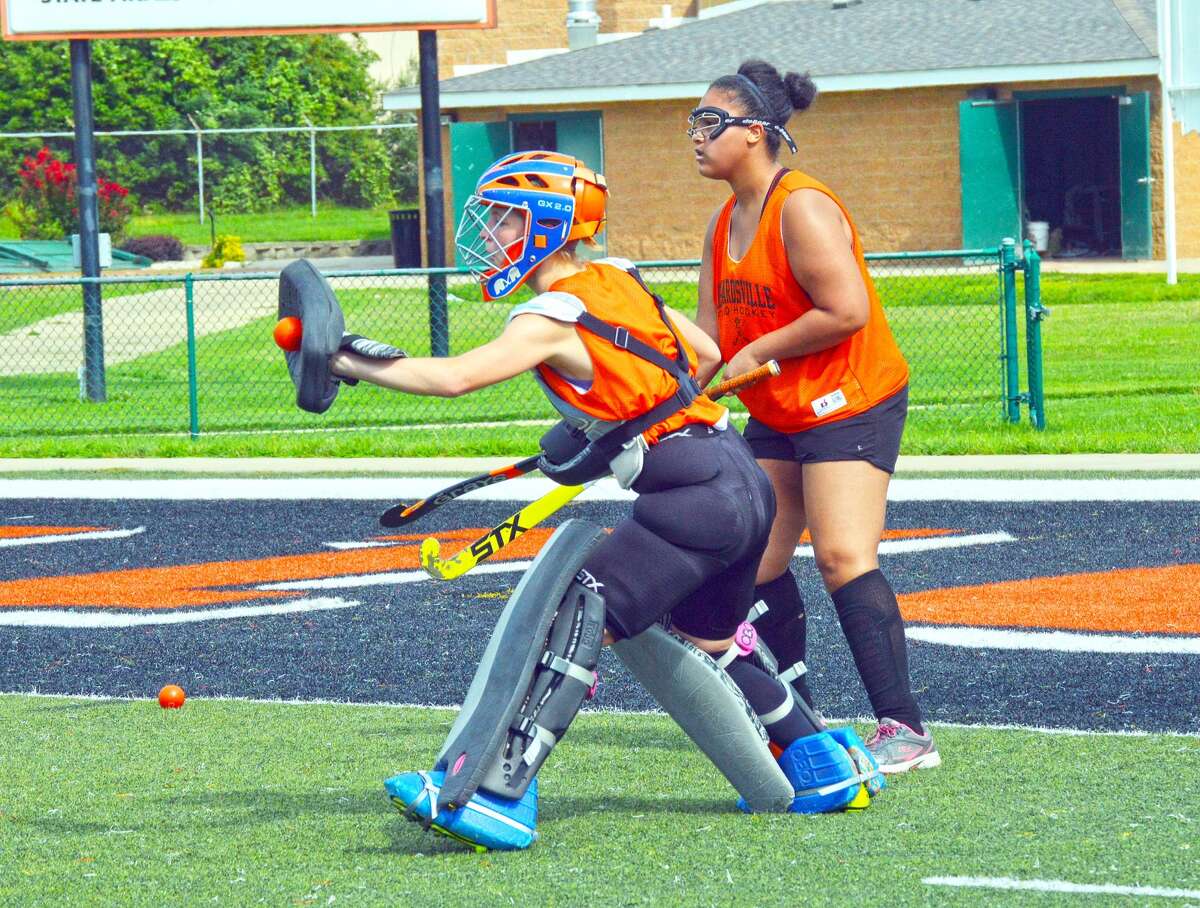 Edwardsville goalie Sarah Blume makes a pad save during practice Tuesday at the District 7 Sports Complex. Blume is entering her senior year.