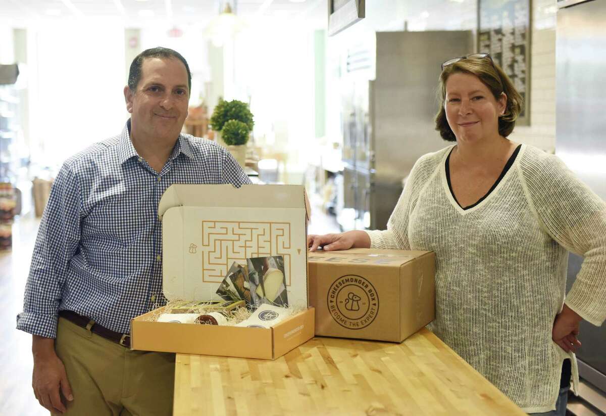 Co-owners and cheesemongers Chris Palumbo, ACS CCP, and Laura Downey, ACS CCP, pose with their Cheesemonger Box at Greenwich Cheese Company in the Cos Cob section of Greenwich, Conn. Monday, July 24, 2017. The Cheesemonger Box is an artisan cheese subscription service where subscribers receive a variety of curated cheeses freshly cut monthly along with educational details about the cheese and how to eat it.