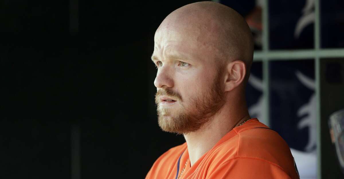 Houston Astros' Derek Fisher watches from the dugout during the fourth inning of a baseball game against the Detroit Tigers, Sunday, July 30, 2017, in Detroit. (AP Photo/Carlos Osorio)