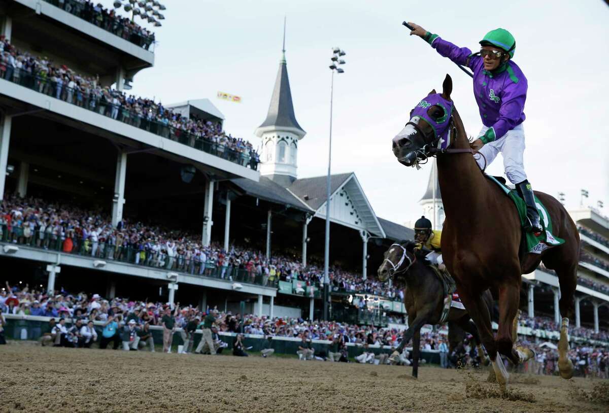 FILE - In this May 3, 2014 file photo, Victor Espinoza rides California Chrome to victory during the 140th running of the Kentucky Derby horse race at Churchill Downs, in Louisville, Ky.Victor Espinoza will have a chance for an unprecedented three-peat in the Kentucky Derby, after all. The jockey who won the Derby with California Chrome in 2014 and with eventual Triple Crown winner American Pharoah in 2015 has landed aboard long shot Whitmore, Espinoza?’s agent Brian Beach said Wednesday, April 27, 2016. (AP Photo/David J. Phillip,m File) ORG XMIT: NY1643