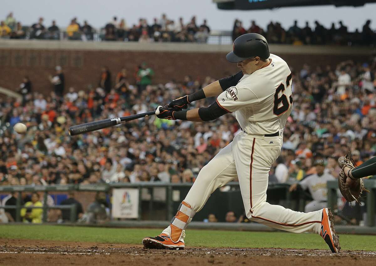 San Francisco Giants' Ryder Jones hits an RBI-single against the Oakland Athletics during the second inning of a baseball game in San Francisco, Thursday, Aug. 3, 2017. (AP Photo/Jeff Chiu)