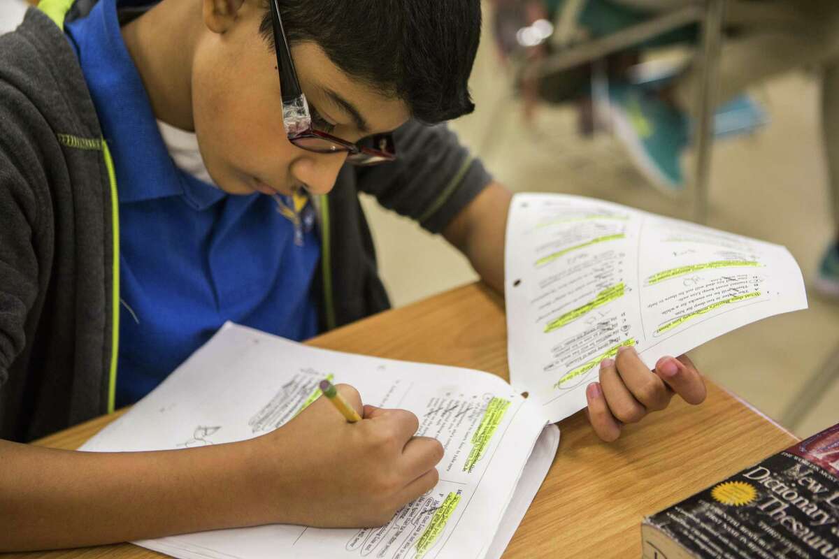 David Torres, a student at Houston Gateway Academy in Houston, reviews for the State of Texas Assessments of Academic Readiness on May 1. The vast majority of districts received passing grades in the results that recently were released, but that’s not good enough if students aren’t prepared for the next steps after graduation.