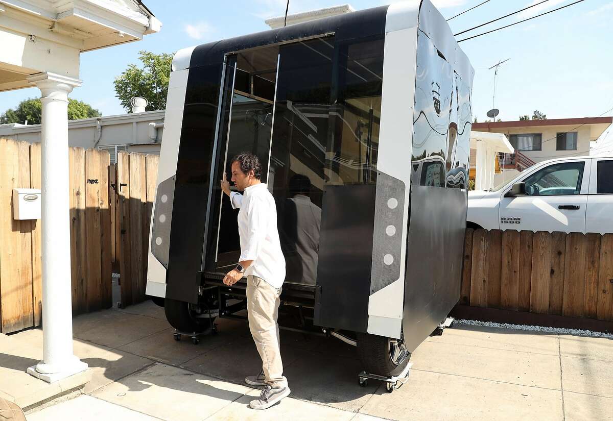Next Future Transportation's Emmanuele Spera with his self-driving transportation system pod prototype at the business in San Jose, Calif. on Wednesday, August 2, 2017.