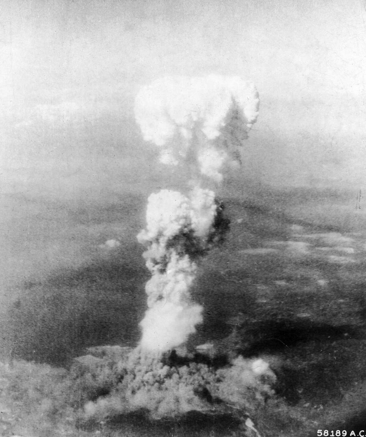 Aerial view of the mushroom cloud of smoke as it billows 20,000 ft. in the air, following the United States Air Force's detonation of an atomic bomb over the city of Hiroshima, Japan, August 6, 1945. (Photo by Time Life Pictures/US Army Air Force/The LIFE Picture Collection/Getty Images)