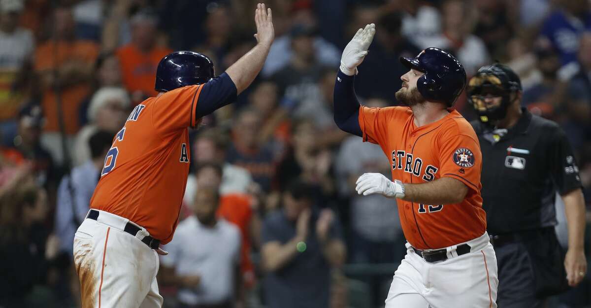 Houston Astros Tyler White (13) celebrates his two-run home run with Brian McCann (16) during the sixth inning of an MLB game at Minute Maid Park, Friday, Aug. 4, 2017, in Houston. ( Karen Warren / Houston Chronicle )
