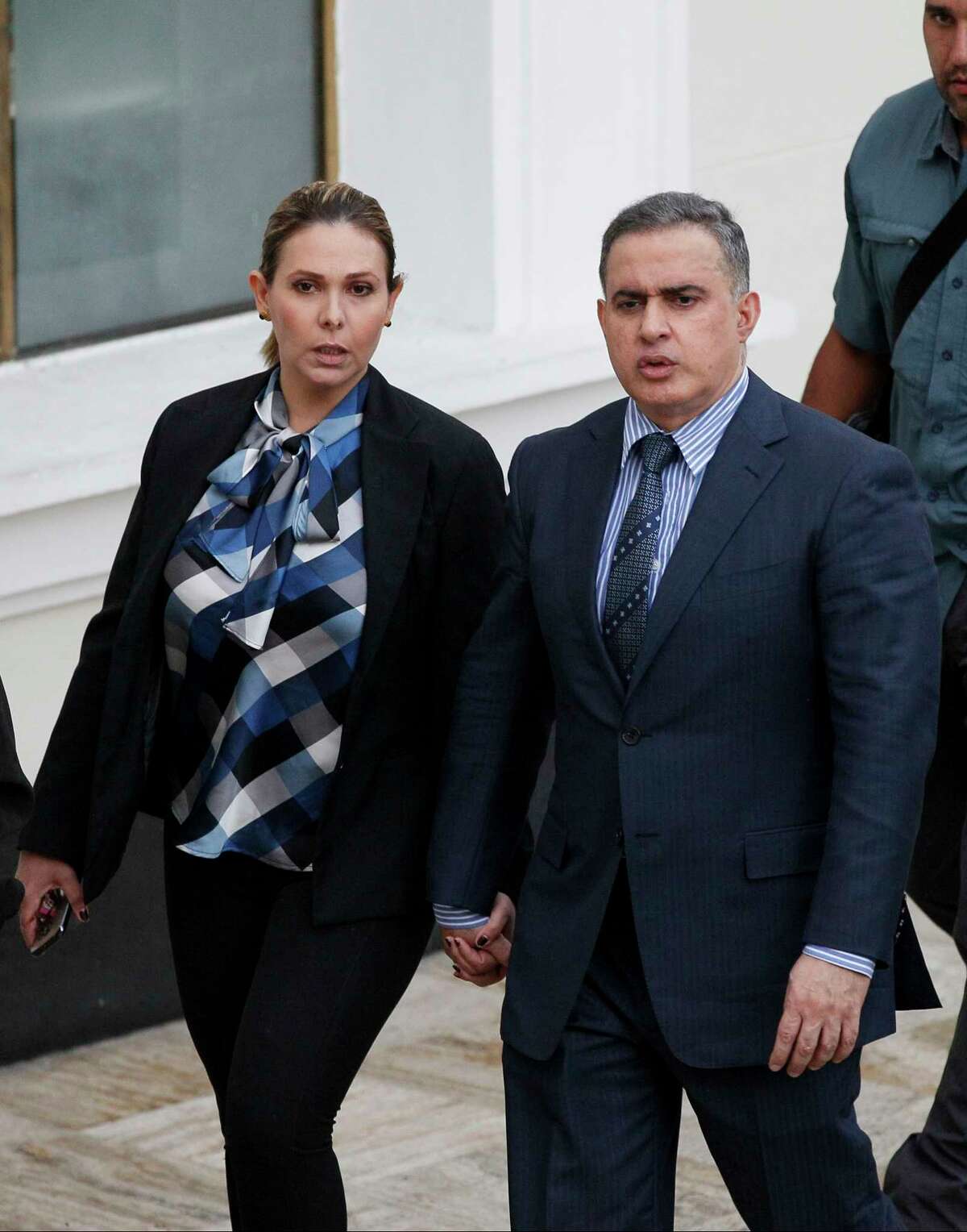 Venezuela's ombudsman Tarek William Saab, right, and his wife Carla Di Martino arrive to Constitutional Assembly, in Caracas, Venezuela, Saturday, Aug. 5, 2017. A newly installed constitutional assembly ousted Venezuela's defiant chief prosecutor, a sign that President Nicolas Maduro's embattled government intends to move swiftly against critics and consolidate power amid a fast-moving political crisis. (AP Photo/Ariana Cubillos)