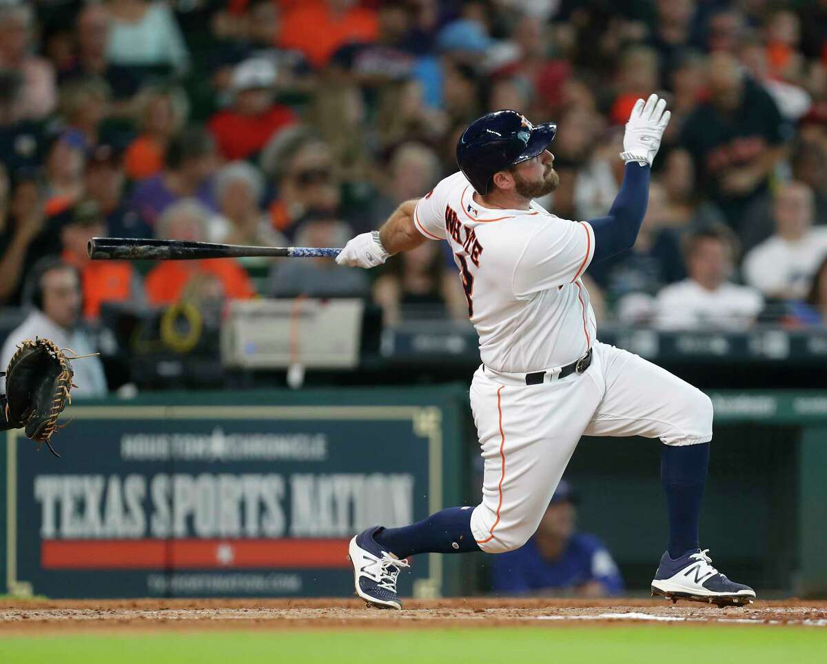 Houston Astros Tyler White (13) hits a home run during the third inning of an MLB game at Minute Maid Park, Saturday, Aug. 5, 2017, in Houston.
