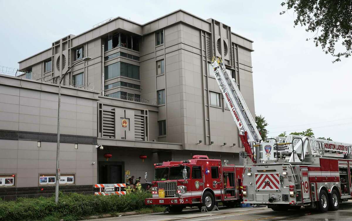 Houston Fire Department firefighters responde to a two-alarm fire at the Consulate General of the People's Republic of China on Montrose Boulevard Sunday, Aug. 6, 2017, in Houston. Dozens of fire trucks were at the scene and no one was injured.