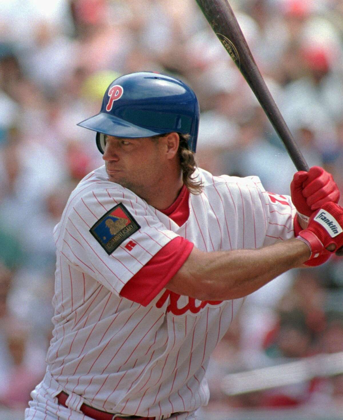 FILE- In this April 19, 1994, file, photo, Philadelphia Phillies' Darren Daulton bats against the Los Angeles Dodgers in Philadelphia. Daulton, the All-Star catcher who was the leader of the Phillies' NL championship team in 1993, has died. He was 55. (AP Photo/George Widman, File)