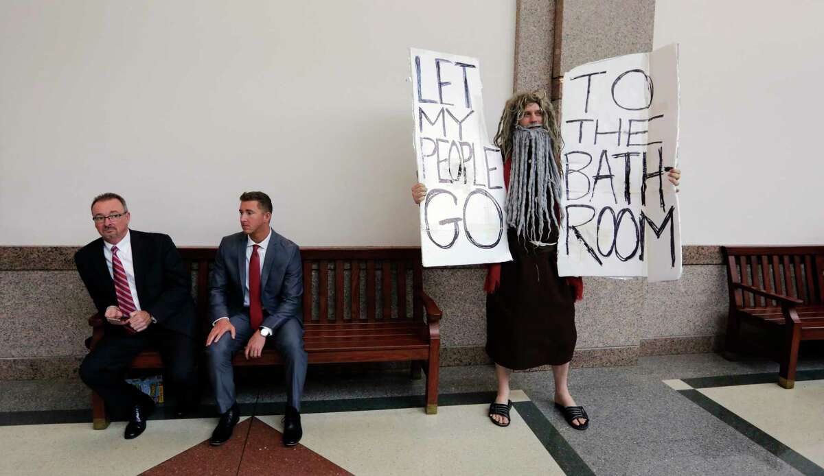 John Erler protests as the Senate State Affairs Committee begin hearings about Senate Bill 6 at the Texas Capitol, Tuesday, March 7, 2017, in Austin, Texas. The the transgender "bathroom bill" would require people to use public bathrooms and restrooms that correspond with the sex on their birth certificate. (AP Photo/Eric Gay)
