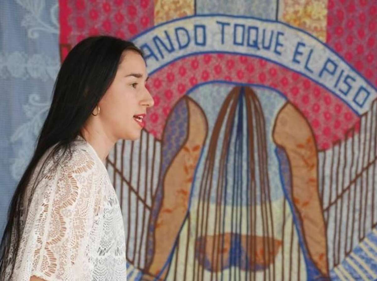 Nansi Guevara, a Martin High School graduate, is pictured in front of her piece titled “Siente nuestro poder” (“Feel Our Power”).  