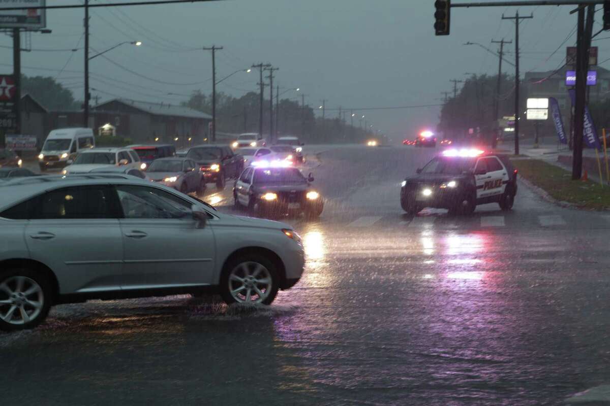Police vehicles block north bound traffic on Babcock Rd at Callaghan due to high water on Monday Aug. 7, 2017.