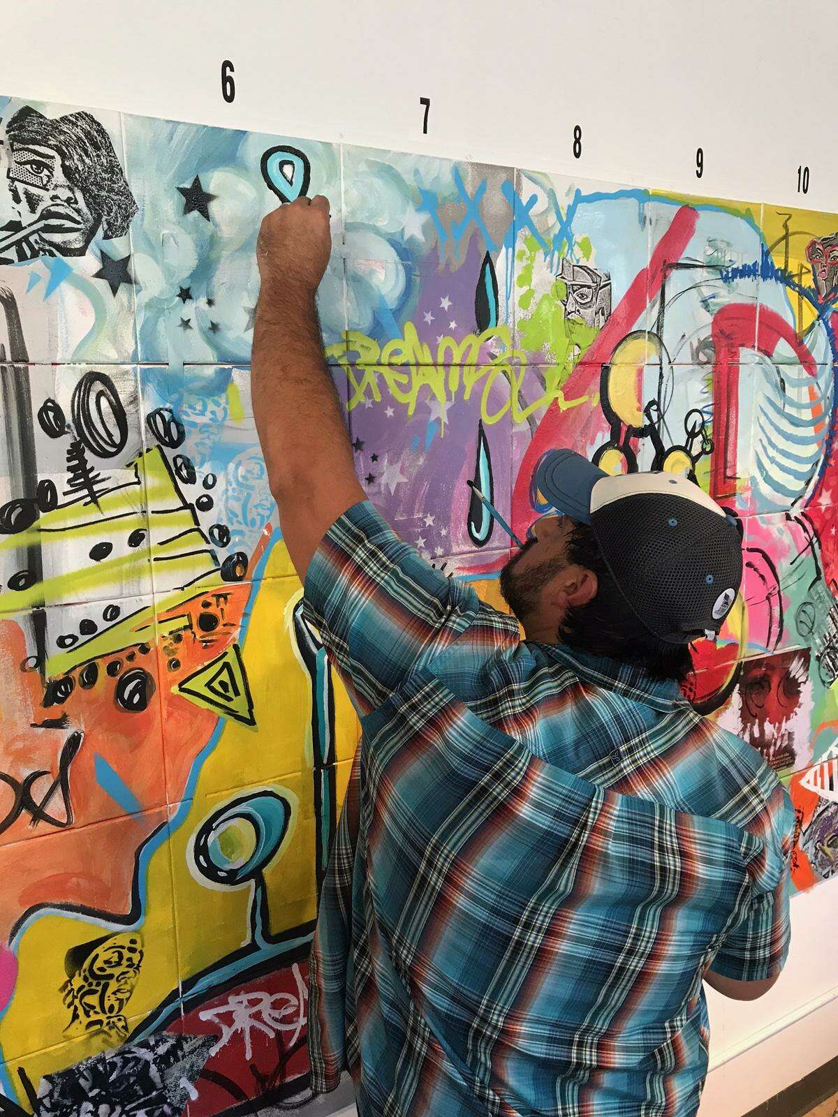 Stamford's Danger Gallery sold out its latest show, "1X1," for which seven Connecticut artists -- Holly Danger, Marc DeRosa, Marcella Kovac, Ben Quesnel, Cris Dam, Liz Squillace and Jahmane Artz -- painted a mural in front of 200 guests on Aug. 5.