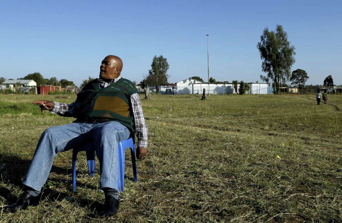 Retired mine worker William Mothabeng speaks to The Associated Press during an interview at a park in Welkom, South Africa. Tens of thousands of South African miners with lung disease prepare to sue some of the country’s largest gold mining companies.