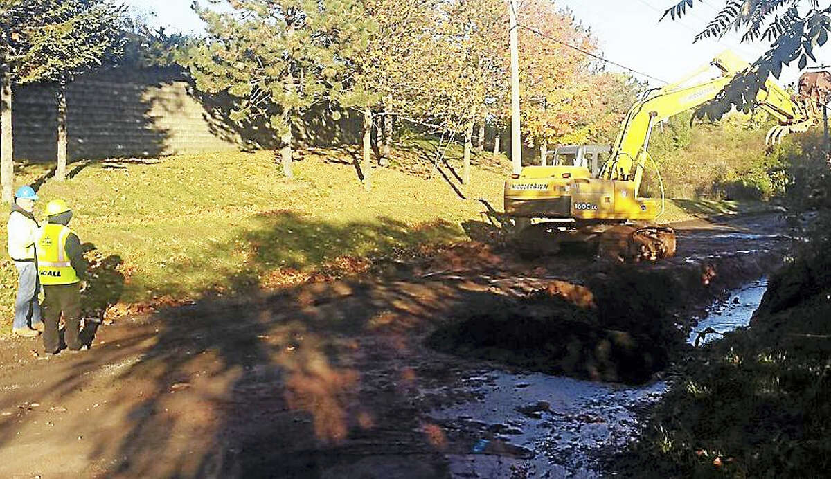 (Cassandra Day/The Middletown Press)Crews worked to isolate and repair a major water main break early Wednesday on Silvermine Road in Middletown. The water main break shut down city schools and affected surgeries at Middlesex Hospital.