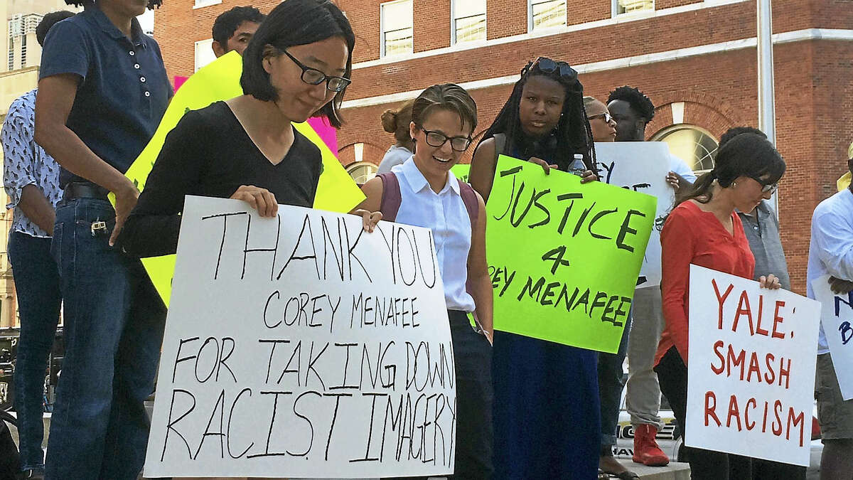 (Wes Duplantier/The New Haven Register) Dozens of people protested Tuesday outside New Haven Superior Court, 121 Elm St., to show their support for former Yale worker Corey Menafee. Menafee resigned from the university and was criminally charged after he allegedly broke a window display depicting slavery at Calhoun College.