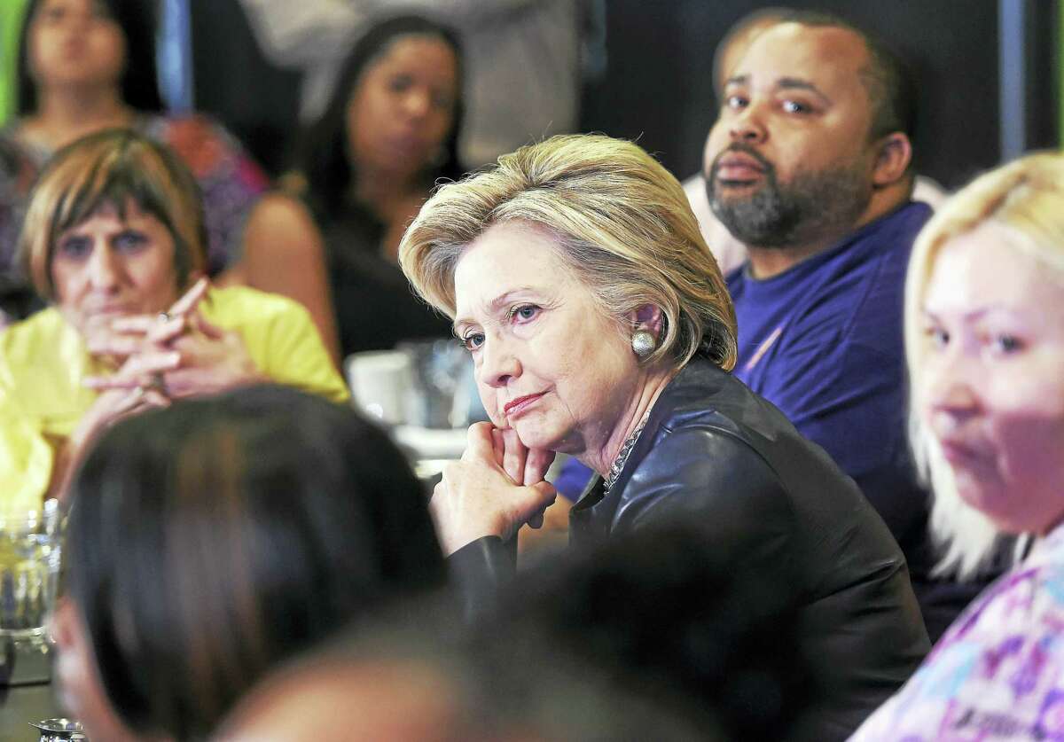 (Arnold Gold-New Haven Register) Democratic presidential candidate Hillary Clinton (center) listens to concerns from the audience during a campaign stop at Orangeside on Temple in New Haven, Connecticut, on April 23, 2016.