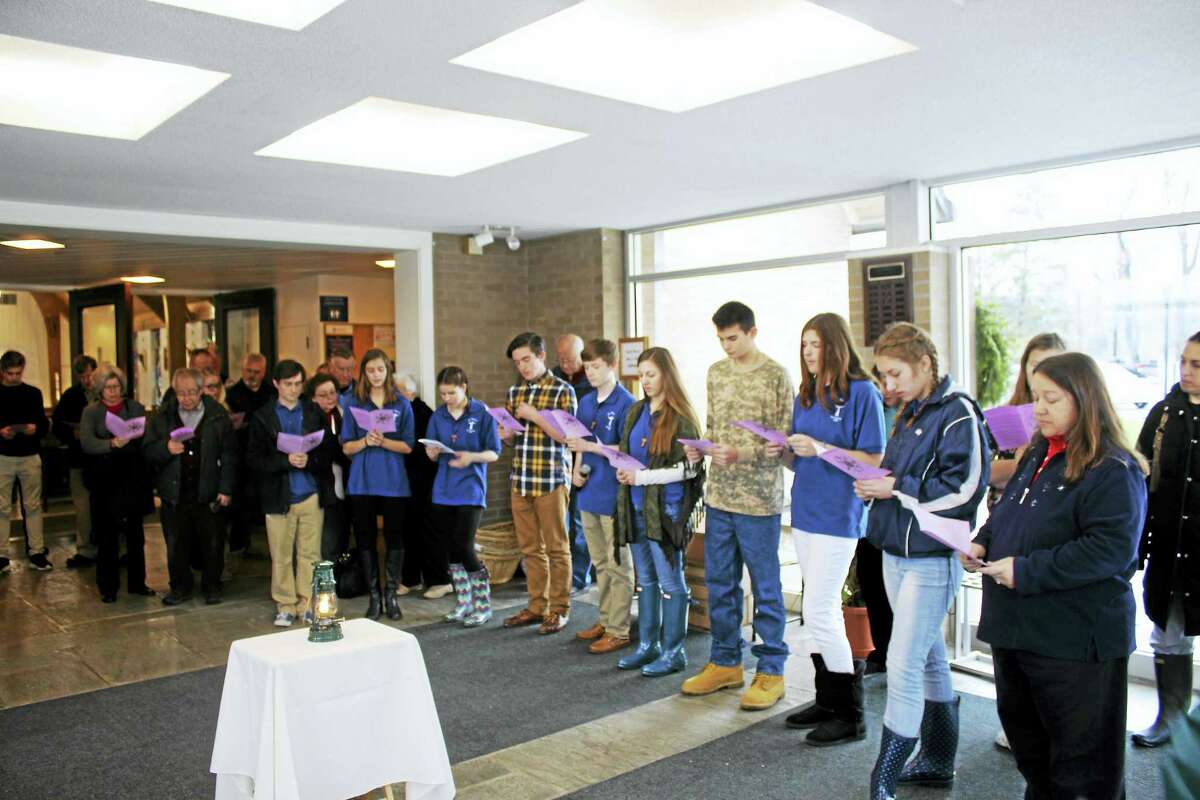 Will Molski Photo Members of the St. Pius Peer Ministry speak during their Peace Circle event between masses Sunday.