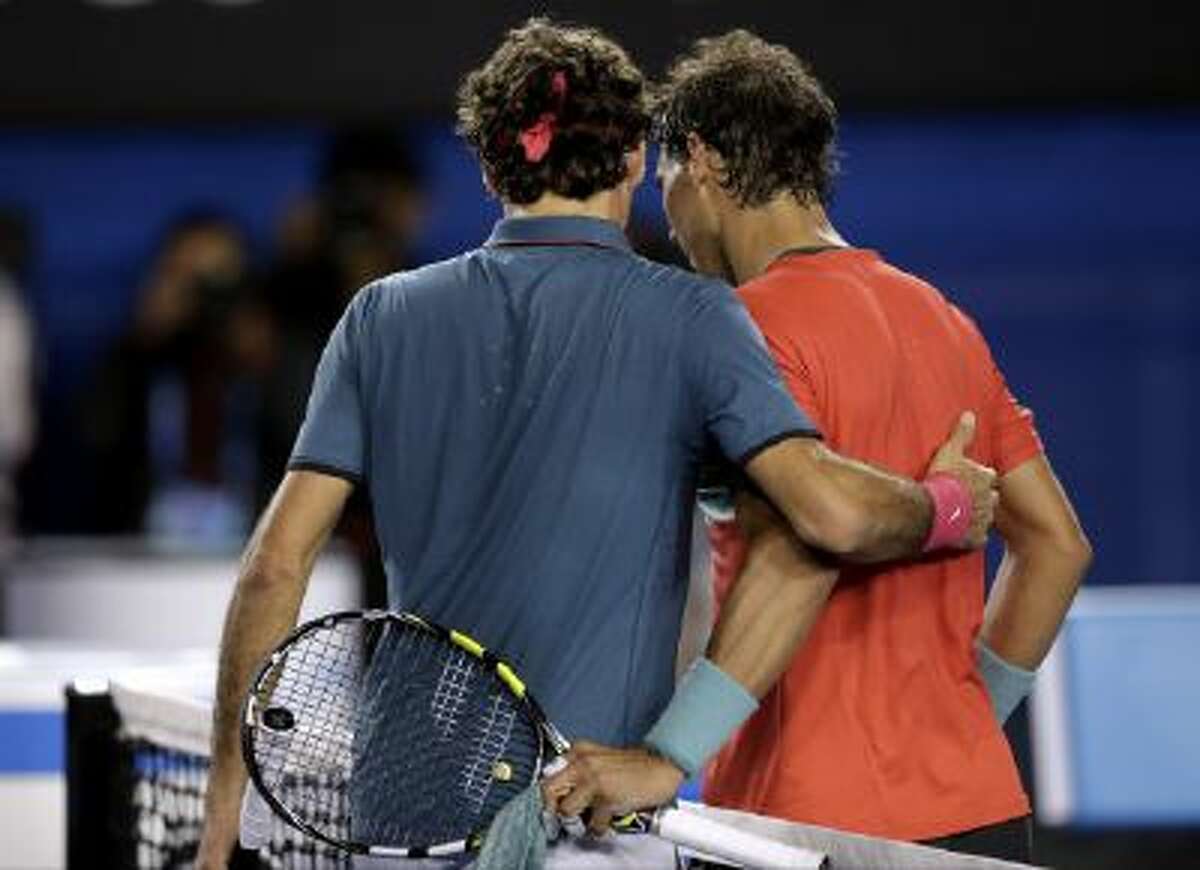 Rafael Nadal is congratulated by Roger Federer after Nadal's win.