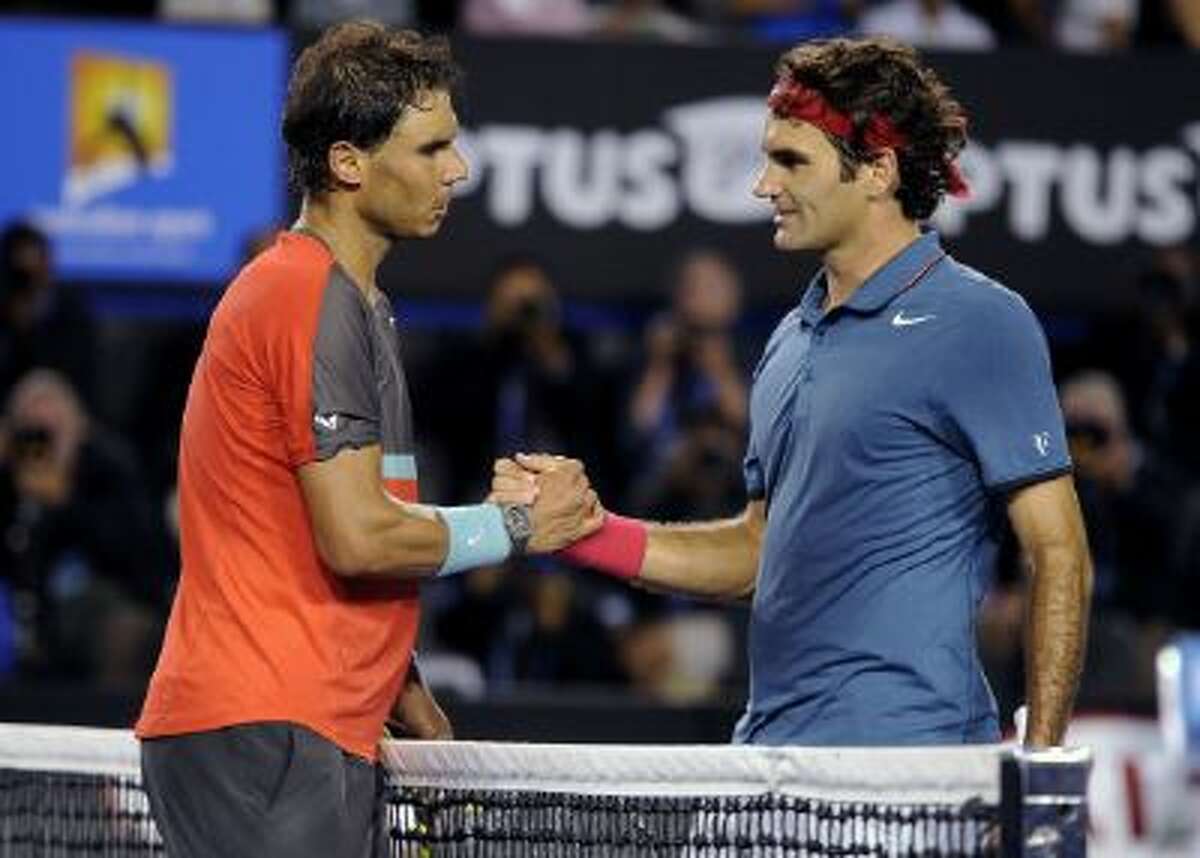 Rafael Nadal of Spain, left, is congratulated by Roger Federer of Switzerland at the net after Nadal won their semifinal final at the Australian Open tennis championship in Melbourne, Australia.