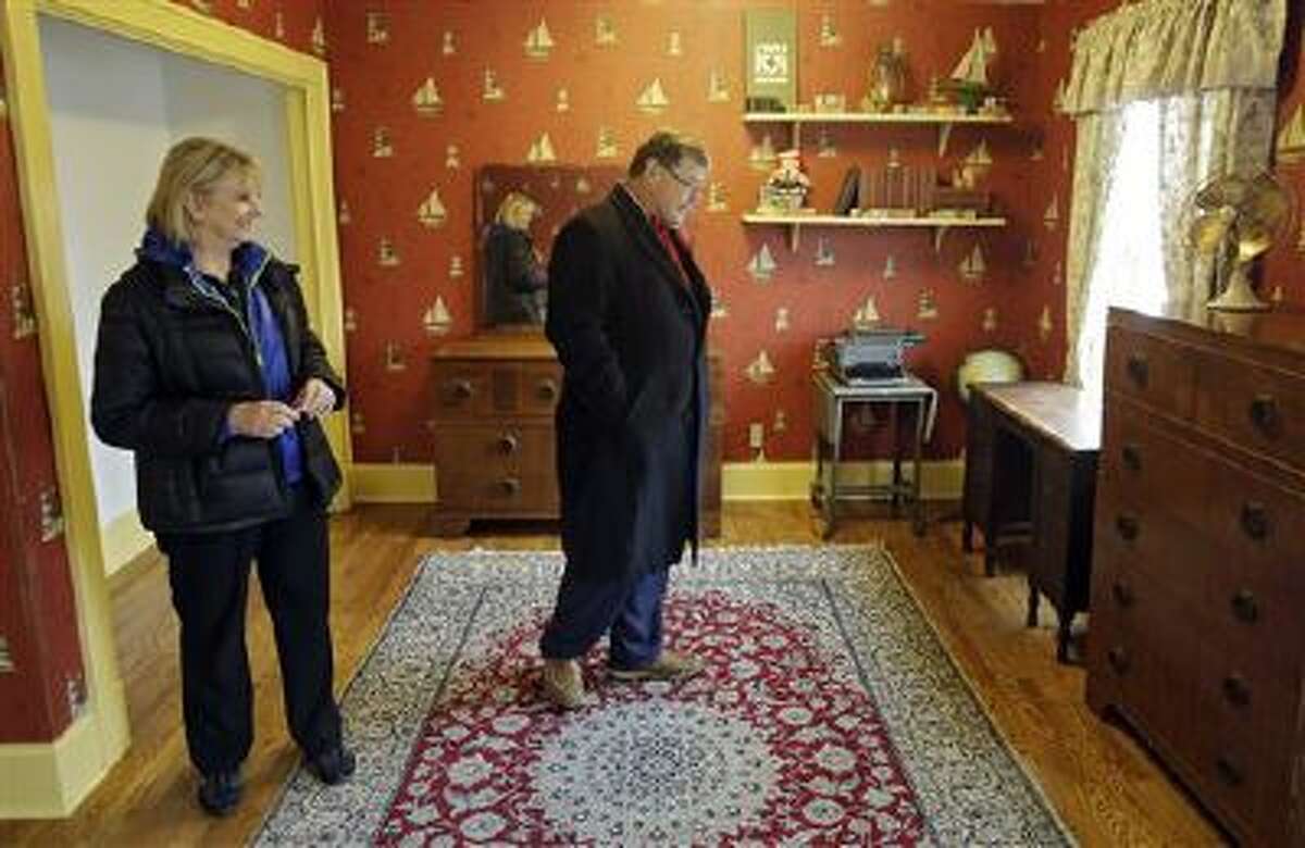 In this Nov. 21, 2013, photo, Judy and Michael Paulson, from Plano, Texas, view Ralphie's room in the Cleveland house where the 1983 movie "A Christmas Story" was filmed.