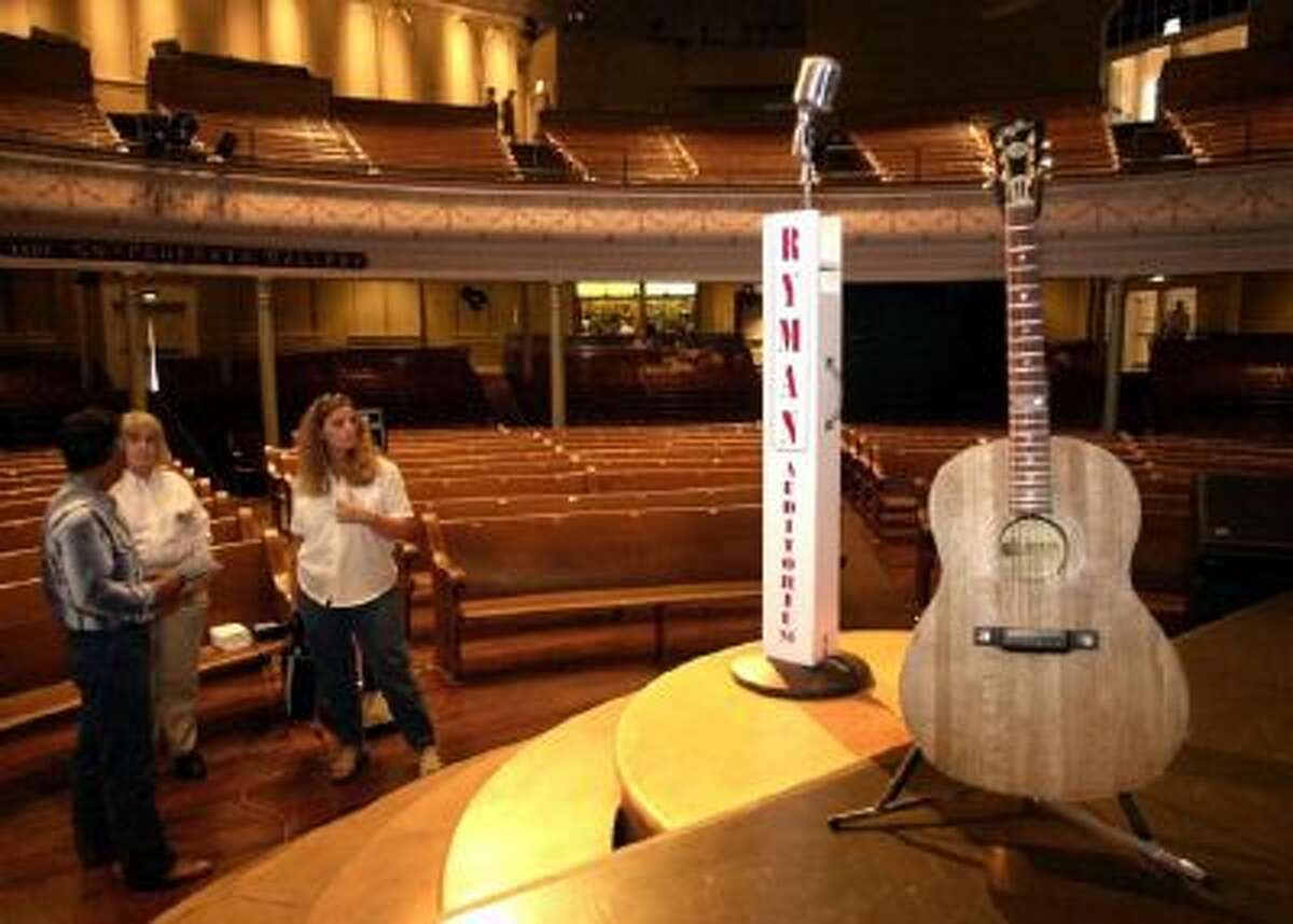 This July 21, 2000 photo shows people touring the Ryman Auditorium in Nashville, Tenn. The wood floors and pews of the former tabernacle make it one of the best venues anywhere for hearing music. The small size also makes it one of the best for seeing performances.