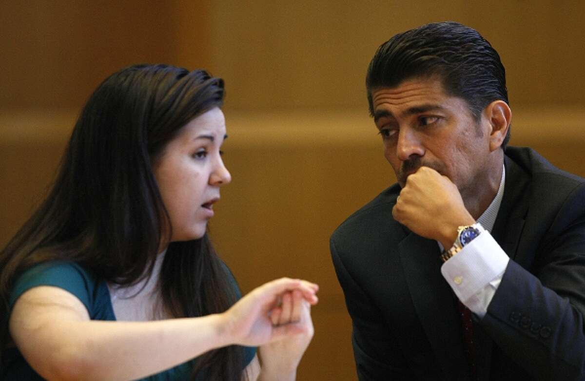 Jennifer Mee talks with her attorney Bryant Camareno, as jury selection begins her murder trial, Tuesday, Sept. 17, 2013, at the Pinellas County Justice Center in Clearwater, Fla. Mee, 22, who found fame in 2007 as a teen because of her uncontrollable hiccupping, is charged with first-degree murder in the 2010 death of Shannon Griffin. (AP Photo/The Tampa Bay Times, Scott Keeler, Pool)