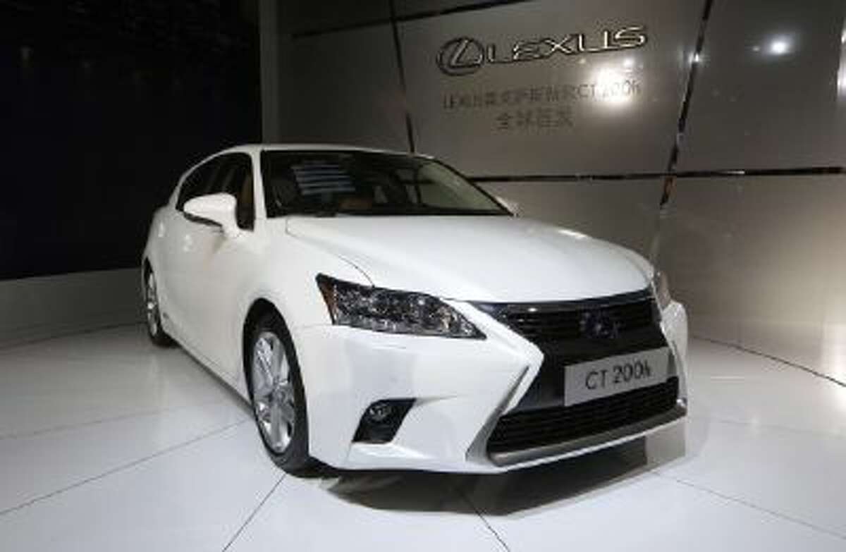 The new unveiled Lexus CT 200h is displayed at the company's booth during Guangzhou 2013 Auto Show in China's southern city of Guangzhou, Nov. 21.