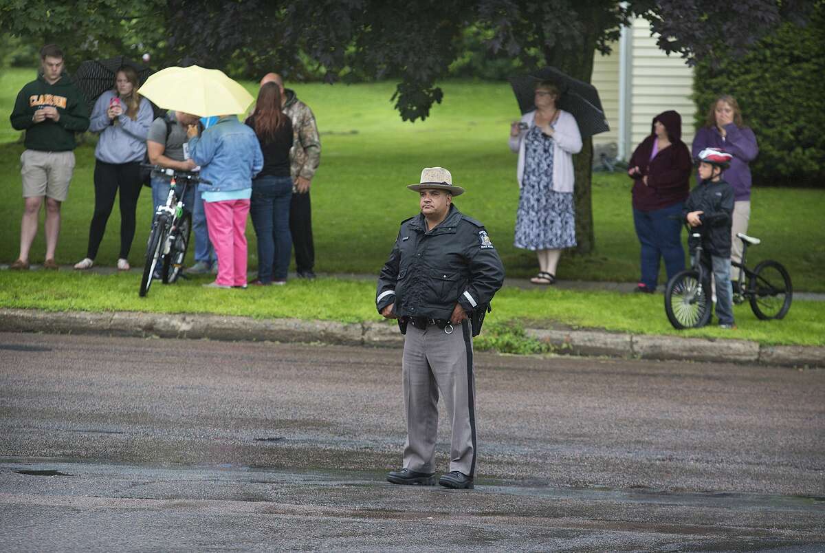 A law enforcement officers stands outside Alice Hyde Medical Center in Malone, N.Y., Sunday, June 28, 2015, where David Sweat was taken after being shot and captured. Sweat's capture came two days after his fellow escapee, Richard Matt, was killed in a confrontation with law enforcement while holding a shotgun. Sweat was unarmed when he was shot twice by a state police sergeant as the fugitive ran for a tree line. (Jason Hunter/Watertown Daily Times via AP)