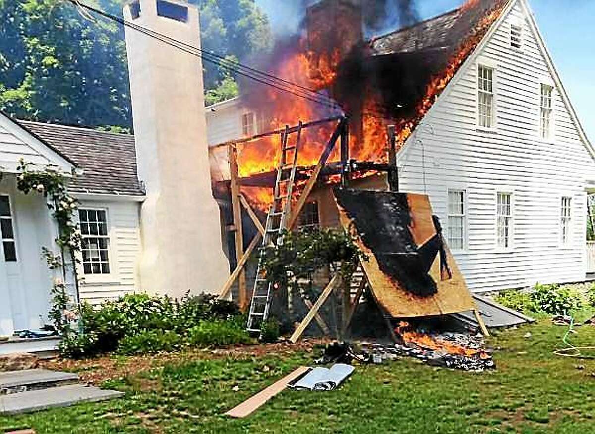 (Photos via the Deep River Fire Department) Crews from Deep River, Essex, Chester, Westbrook and Old Saybrook battled a house fire Thursday at 83 River Road in Deep River. Officials said the fire started in a truck parked near the house.