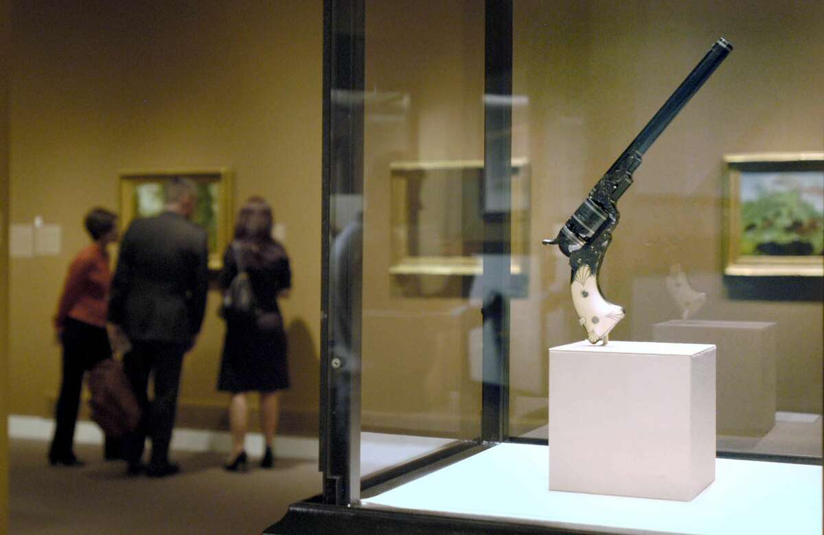 FILE - In this Sept. 15, 2006 file photo, Samuel Colt's No. 5 holster pistol is displayed in an exhibit at the Wadsworth Atheneum in Hartford, Conn. The 179-year-old gun maker filed for chapter 11 bankruptcy on Sunday, June 14, 2015, estimating it owes up to $500 million. Analysts cite several reasons behind Colt's bankruptcy filing, including struggles to recover from the loss of military business and failure to capitalize on consumer interest in guns. (AP Photo/Carol Phelps, File)
