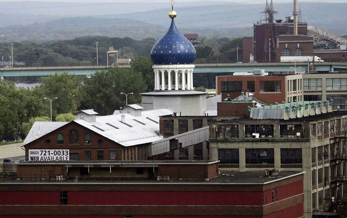 FILE -- In this July 22, 2008 file photo, the blue dome of the former Colt firearms factory sits atop the Coltsville complex in Hartford, Conn. The 179-year-old gun maker filed for chapter 11 bankruptcy on Sunday, June 14, 2015, estimating it owes up to $500 million. Analysts cite several reasons behind Colt's bankruptcy filing, including struggles to recover from the loss of military business and failure to capitalize on consumer interest in guns. (AP Photo/Bob Child, File)