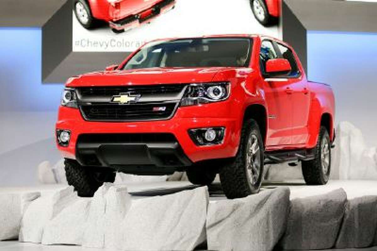 The new 2015 Chevrolet Colorado is introduced at the Chevrolet booth at the Los Angeles Auto Show on Wednesday, Nov. 20, 2013, in Los Angeles.
