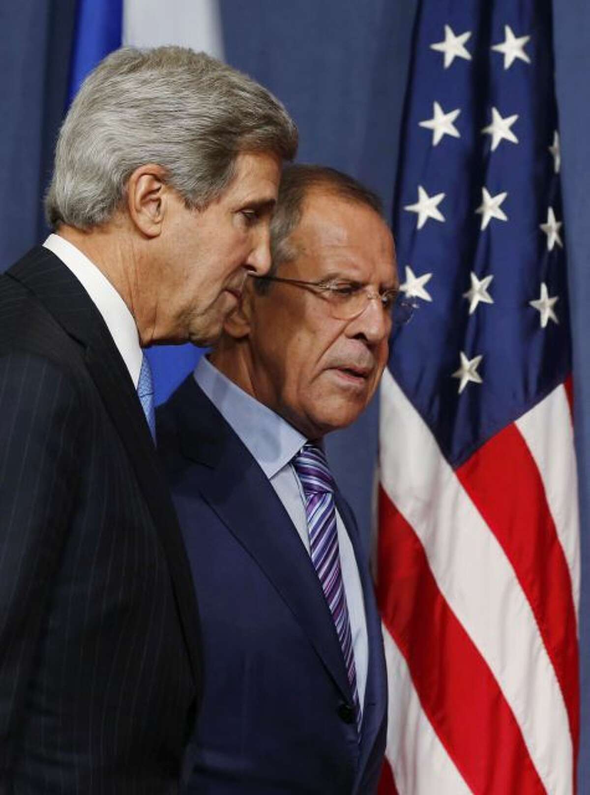 U.S. Secretary of State John Kerry and Russian Foreign Minister Sergey Lavrov, right, arrive for their press conference before their meeting to discuss the ongoing crisis in Syria, in Geneva, Switzerland, Thursday Sept. 12, 2013. Secretary of State John Kerry and his team have opened two days of meetings with their Russian counterparts in Geneva. Kerry is hoping to come away with the outlines of a plan for securing and destroying vast stockpiles of Syrian chemical weapons. (AP Photo/Larry Downing, Pool)