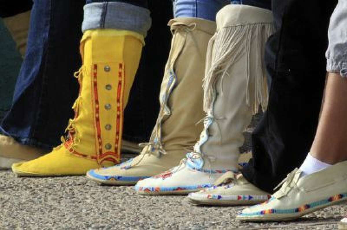 Participants display their moccasins during the "Rock Your Mocs" celebration at the Indian Pueblo Cultural Center in Albuquerque, N.M., on Friday, Nov. 15, 2013.