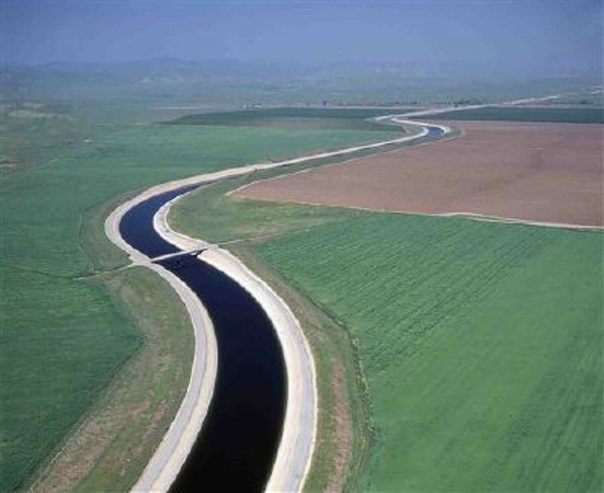 FILE -Water makes its way south through the Central Valley by way of the California Aqueduct in this undated handout photo. A judge orders the a giant Southern California water wholesaler to reset rates in response to claims that ratepayers in San Diego were subsidizing the rest of the region. (AP Photo/California Department of Water Resources, Dale Kolke, File)