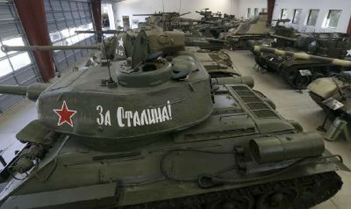 This Wednesday, Nov. 6, 2013 photo shows a Medium Tank T-34/85 from Russia, foreground, displayed with other tanks at the Military Vehicle Technology Foundation in Portola Valley, Calif.